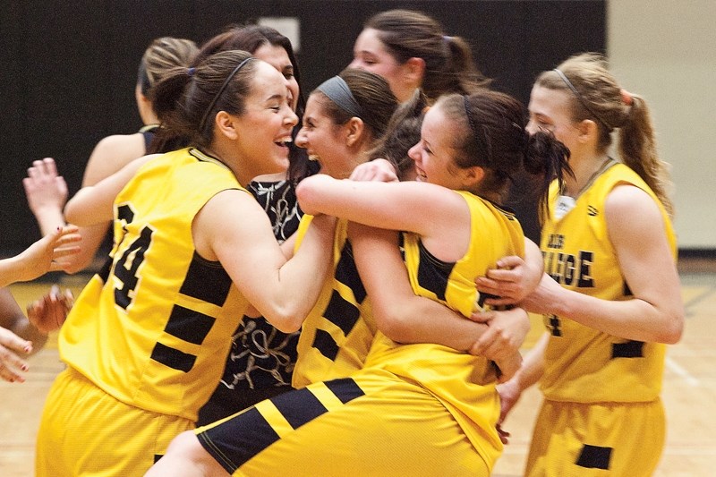 The Olds College Broncos varsity women&#8217;s team celebrates after winning the ACAL championship at Ralph Klein Centre last Saturday. The varsity team defeated the Broncos