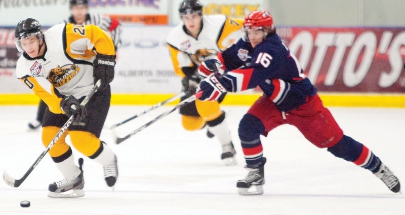 Olds Grizzlys player Tanner Sather rushes down the ice during the Grizzlys&#8217; game against the Brooks Bandits at the Olds Sportsplex on March 26. The Grizzlys were