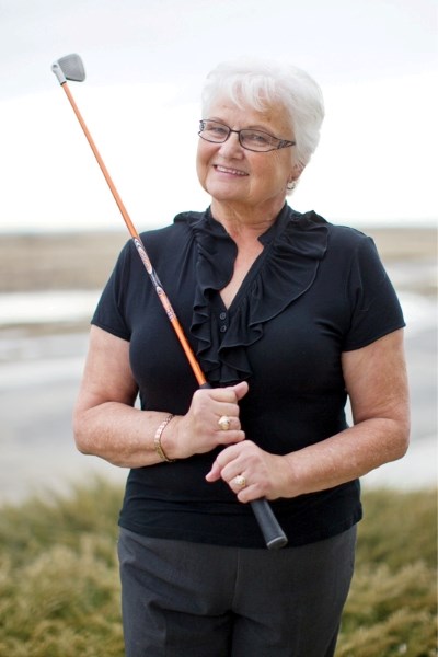 Joan Qually outside her home in Olds last Tuesday.