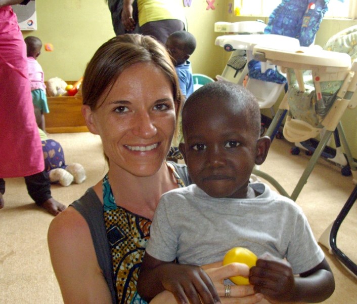 Dawn Hallworth with child David at the Sanyu Babies Home in Kampala, Uganda. The Olds native spent almost all of last June at the orphanage as a volunteer.