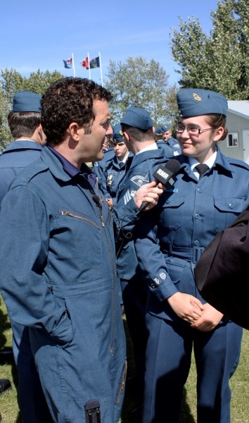 Canadian comedic icon Rick Mercer interviews Emilee Penwarden, an air cadet with the 185 Olds Squadron, during the television star&#8217;s visit to the Netook Gliding Centre