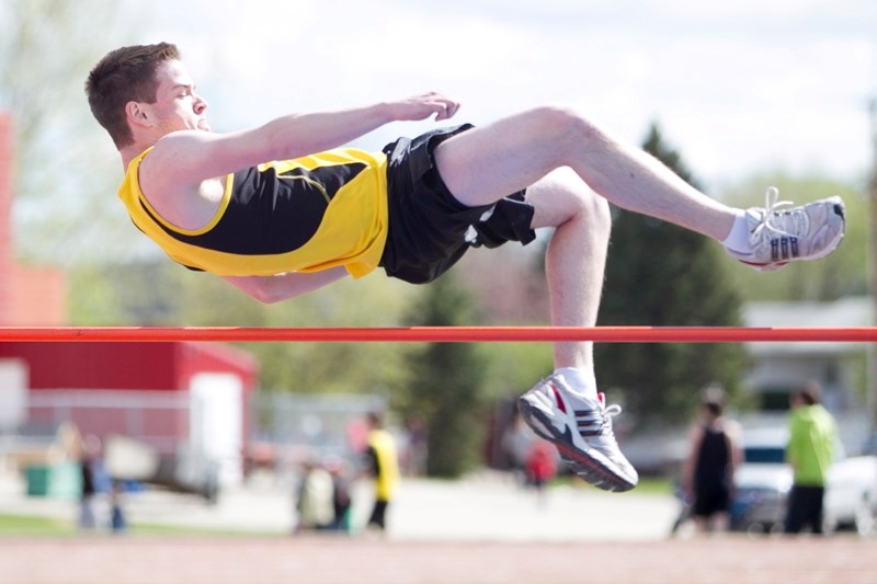 Olds High School student Drew Worth competes in the high jump event during a track and field meet at Westglen School in Didsbury on May 15.