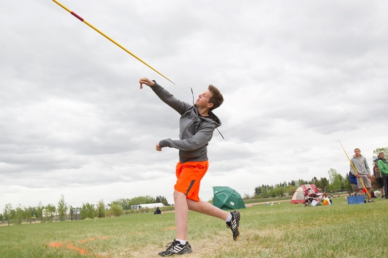 Deer Meadow School student Joshua Carlson competes in the javelin event during a junior track and field meet held at Westglen School in Didsbury on May 22.