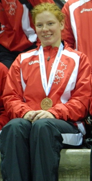 Olds&#8217; Amber Maschke (centre) won a bronze medal in the 55-kilogram women&#8217;s junior freestyle competition at the Pan American Games in Santiago, Chile from July 10