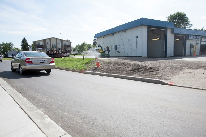 The owners of 2A Car Wash say their business has decreased by roughly 30 per cent since the installation of a new concrete median on Highway 2A earlier this month.