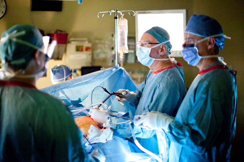 Dr. Sinclair Cox, seen here performing surgery in 2011, has retired after nearly 24 years as a general surgeon at the Olds Hospital and Care Centre.