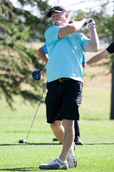 Ex-NHL player Lanny McDonald tees off on the first hole during the Olds College Heritage Fall Golf Classic tournament at the Olds Golf Club on Sept. 11. The event ended up