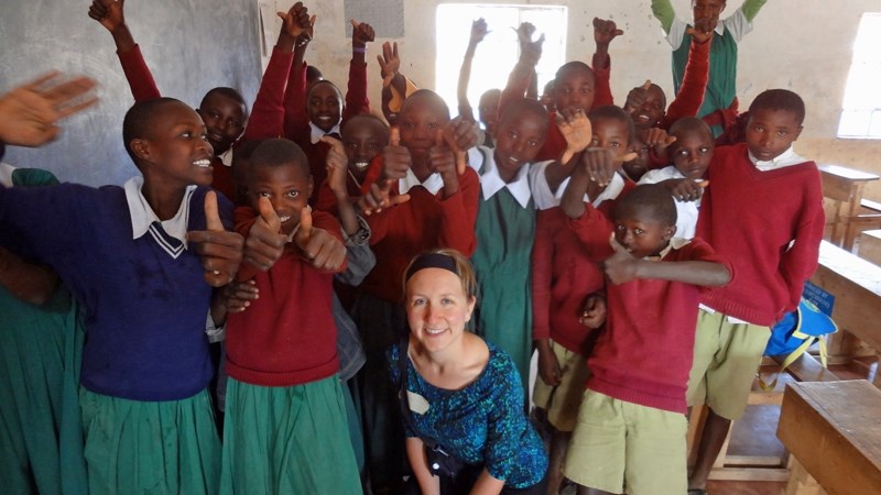 Melanie Hillier poses with a group of students she taught at the Mali Pimary School while in Kenya earlier this summer.