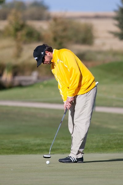 Olds College golfer Adam Boismier makes a putt during the ACAC golf championship in Olds on Sept. 28.
