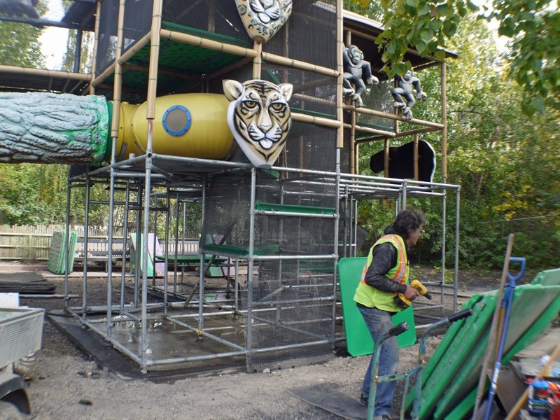 Terry Holt, a hired labourer working for Olds&#8217; The Playground Guys, takes part in repair work at a playground at the Calgary Zoo earlier this month.