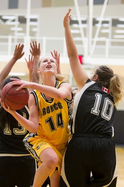 Olds College Broncos varsity player Madison Oystrick goes up for a layup during the Broncos&#8217; exhibition game against the Calgary Storm at Olds College on Oct. 8.