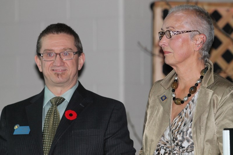 Julie Calderwood, pictured with Olds Rotary Club president-elect Norm McInnis, was named as the club&#8217;s citizen of the year at the club&#8217;s annual Harvest Ball on