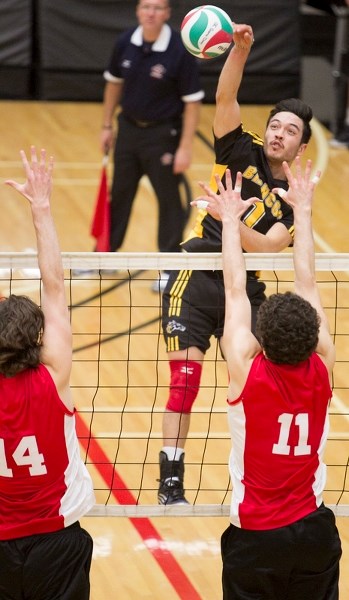 Olds College Broncos player Connor Dooley spikes the ball during a game with the Southern Alberta Institute of Technology at the Ralph Klein Centre on Nov. 14.