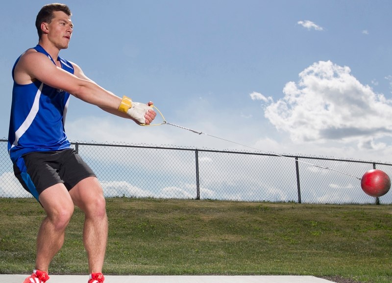 Andreas Troschke practises the hammer throw at a training area next to Olds High School. Troschke won the open/university class weight throw with a throw of 16.01 metres