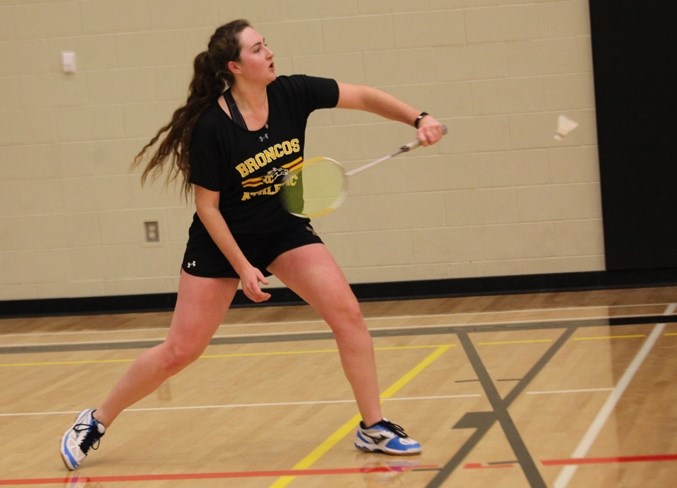 Olds Broncos badminton player Kaitlyn Dougan gets ready to return a shot during provincials in Edmonton. She&#8217;s now preparing for nationals Feb. 28-March 3, also in
