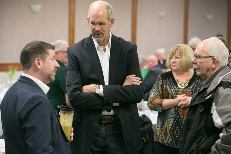 Geoff Thompson, president of Sundial Growers, speaks with Roy Thompson, left, Sundial&#8217;s director of quality assurance, Coun. Debbie Bennett, second from right, and John 