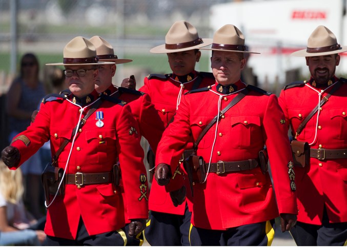 RCMP members march at the front of the parade.