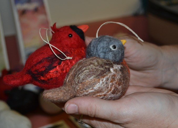 A couple of Lois McDonald-Layden&#8217;s felted ornamental birds.