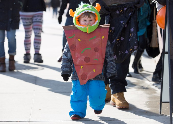 Cassias Zieverink walks along 50th Avenue during Halloween Howl.