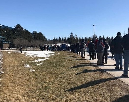 A lengthy line formed outdoors in bitter cold at the Newmarket vaccination clinic Thursday after a technical problem caused a backlog.