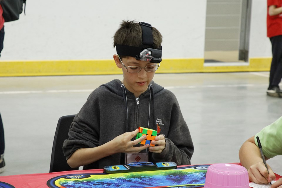 Many speedcubers record their performance, for later analysis and posting online, at the canadianCUBING Newmarket Open Saturday at the Magna Centre.  Greg King for NewmarketToday