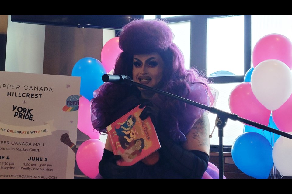 Drag queen Erin Brockobić read two children's books to the attendees at a York Pride media event.