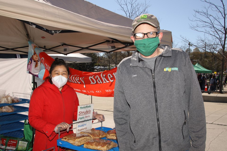 Cindy Zhang of Crown Valley Bakery and Dave Cooper.  Greg King for NewmarketToday