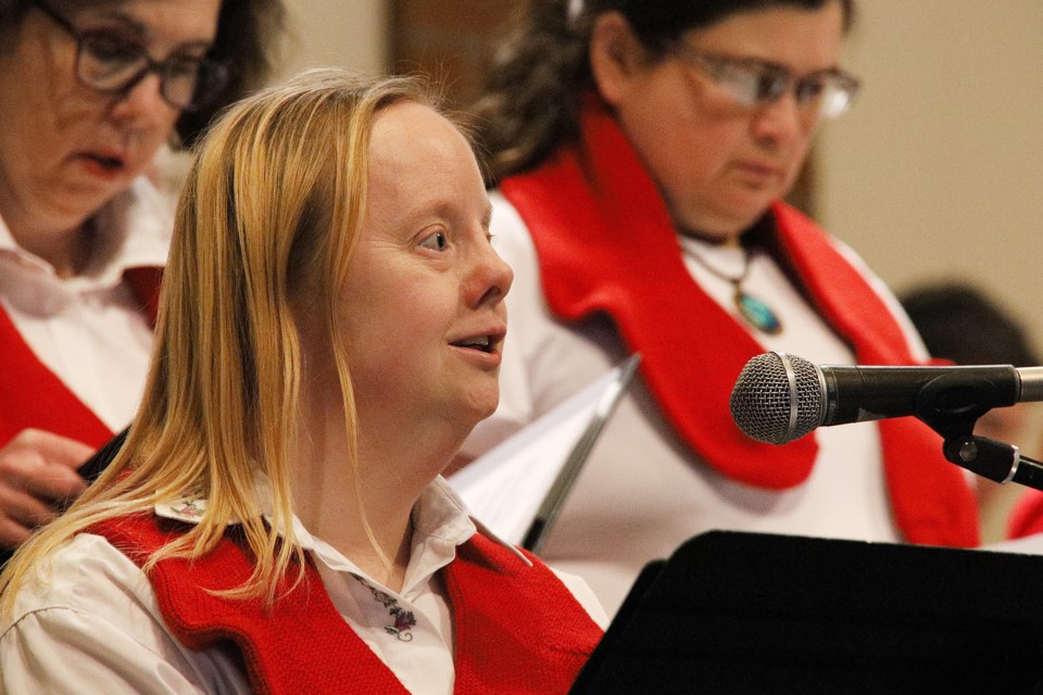 Voices of Joy member Jennifer Sheldrake sings Peace, Peace, Peace at the choir's Christmas performance at Bethel Community Church in Newmarket Dec. 14.  Greg King for NewmarketToday