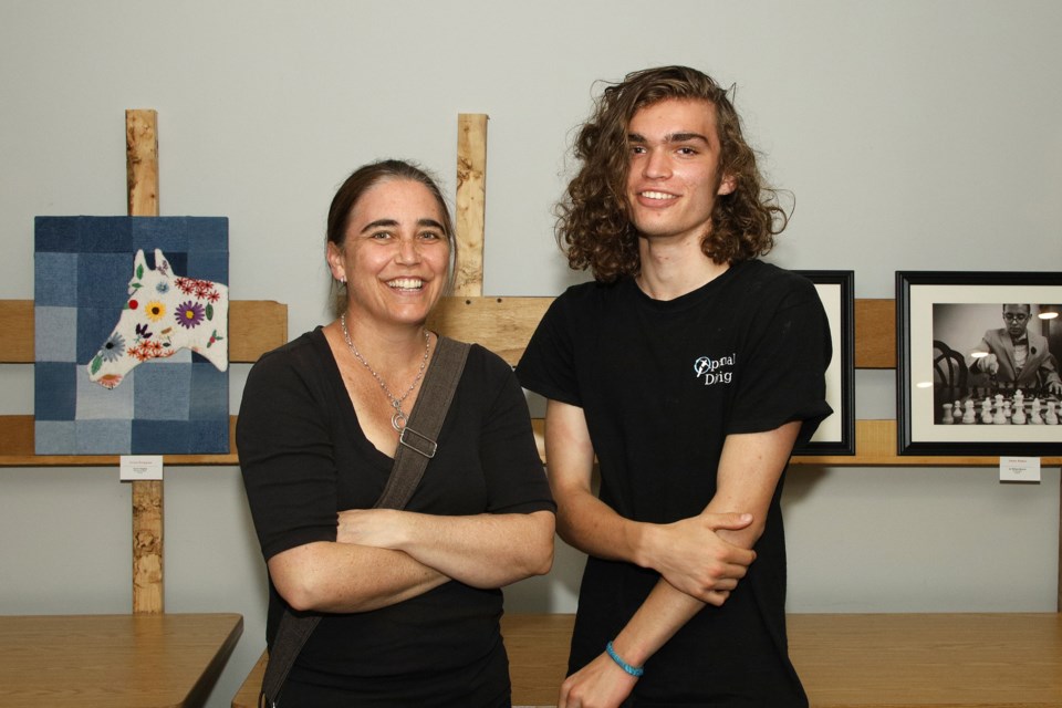The Newmarket Optimist Club hosted a high school art competition this month, with winners announced at the local Optimist Hall May 28. Pictured is 
Conor Burnett with him mom Robin.  Greg King for NewmarketToday