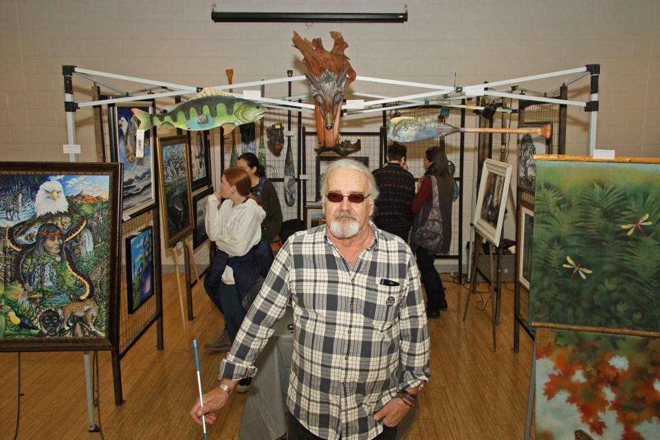 Newmarket Group of Artists' annual ArtWalk and Studio Tour continues, today, Sunday, Oct. 15, from 11 a.m. to 5 p.m. on and around Newmarket's Main Street. Here, artist Steve Brown stand before his display that looks like the cottage.