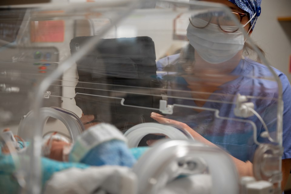 A nurse checks on a newborn at Southlake Hospital's NICU. 