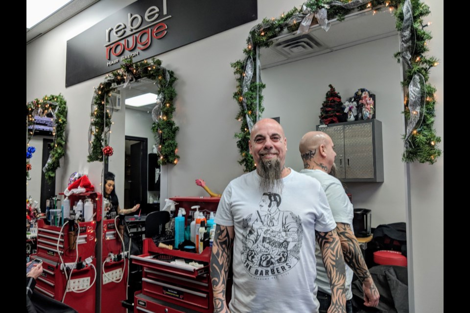 Rebel Rouge Hair Salon owner Roy Jannetta is selling toques from his Leslie Street shop and will match donations that top $2,500 dollar for dollar. Kim Champion/NewmarketToday