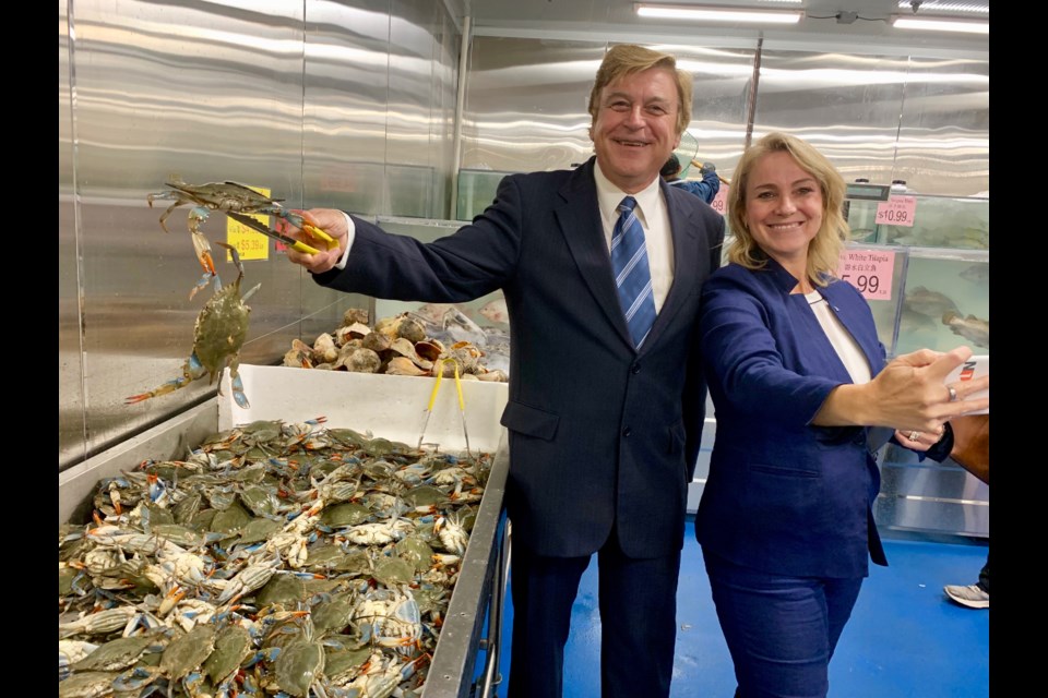 Deputy Mayor Tom Vegh and Ward 1 Councillor Grace Simon check out the live crabs on opening day at Newmarkets's Ranch Fresh Supermarket. Debora Kelly/NewmarketToday
