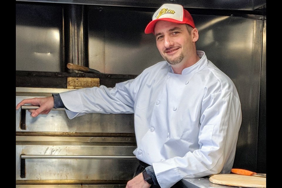 Pizza chef Akos Pataki, who runs A's Pizza Truck with his wife, Erika, this month celebrates the first anniversary of turning the truck into a full-time business. Kim Champion/NewmarketToday