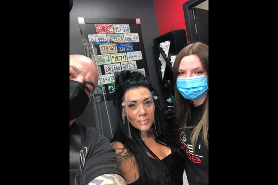 Roy Jannetta, Carmelina Varriano and Kaitlyn Beaton (far right) are eager to get back to work at the Rebel Rouge Hair Salon.