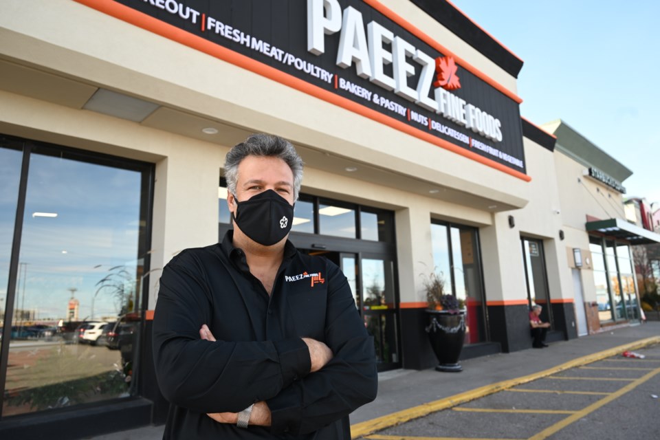 Afshin Yazbani stands in front of his new Persian grocery store, Paeez Fine Foods. 