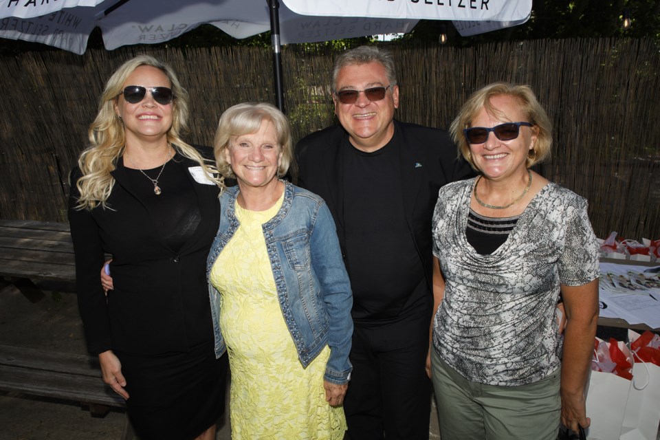 Event organizer and Main Street Realty Ltd. agent Sheila Stewart (Sell it With Sheila) welcomes Jackie Playter, Councillor Bob Kwapis, and Barbara Kwapis at the Celebration of Women of Main Street June 4 at Cachet Supper Club in Newmarket.  Greg King for NewmarketToday