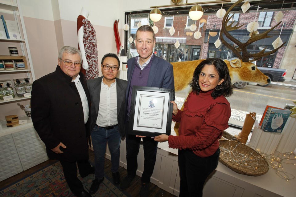 Councillor Bob Kwapis (from left), co-owner Thai Pham, Mayor John Taylor, and co-owner Bianca Martins. Councillor Kwapis and Mayor Taylor officially welcome Pham and Martins to Newmarket.