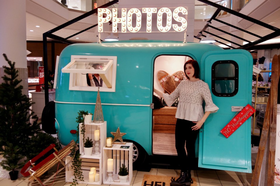 If you're too old to sit on Santa's lap for a photo, you can visit Chantalle Gallego at the Snaptique camper photo booth for a holiday postcard memento at the Merry Market at Upper Canada Mall until Dec. 24. Debora Kelly/NewmarketToday                              