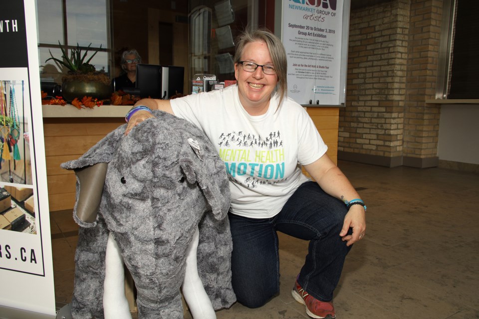 Judy Brunton poses with the mental health elephant by 'sew shenanigans' at the Etsy Made in Canada market Sunday at the Newmarket Old Town Hall.  Greg King for NewmarketToday