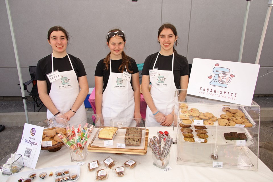 Sugar (Mackenzie), Spice (Rachel) and Everything Nice (Madison) have a professional set-up and branding to display their goods at the inaugural marketplace for young entrepreneurs at Market Brewing Inc. in Newmarket May 4.