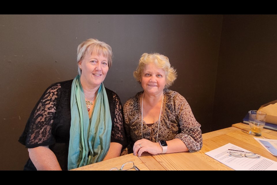 Laurie Brakeboer (left) who founded the local chapter of 100 Women Who Care, with longtime committee member Bev LeBer at the 30th meeting last night in Newmarket. 