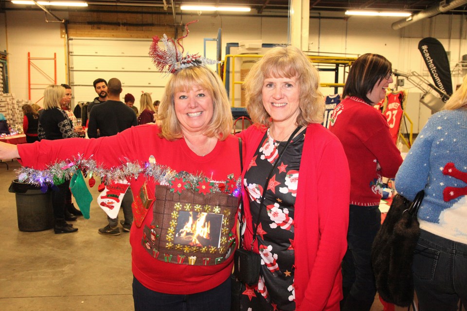 Mali Bickley and Dianne Gerstmann donned ugly sweaters for Saturday's event to raise funds for Inn From the Cold. Greg King for Newmarket Today