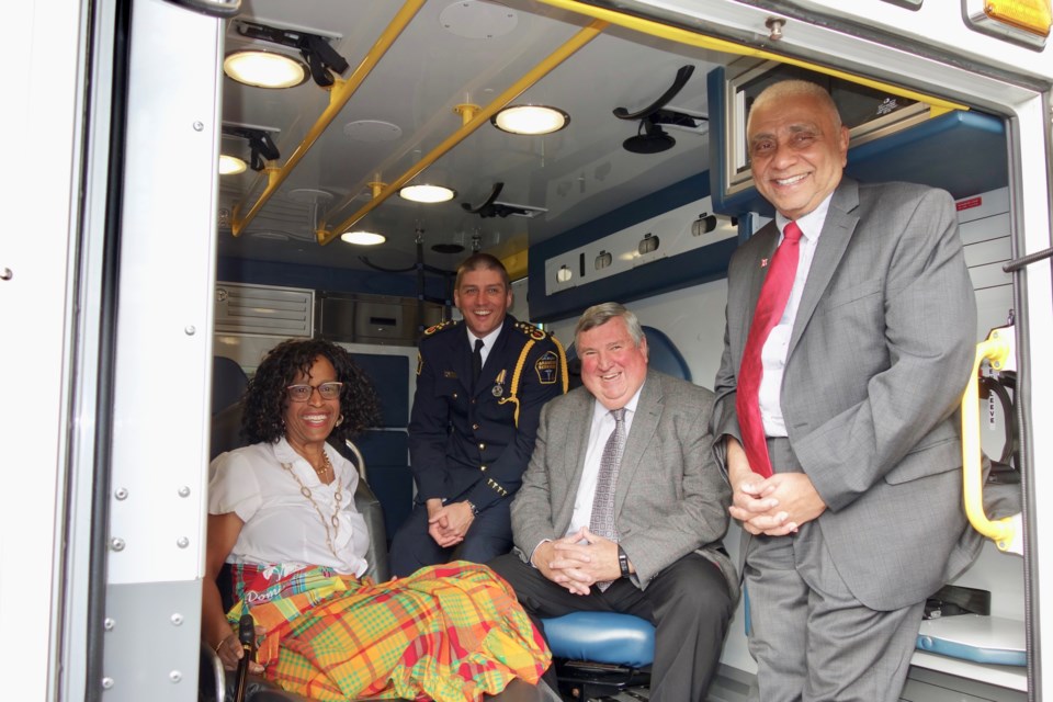 Chris Spearen, acting chief and general manager, York Region Paramedic Services, York Region; York Region Chairman and CEO Wayne Emmerson; and Harry Harakh, president and CEO of Caribbean North Charities Foundation at the decommissioned ambulance donation ceremony at the Region of York Administrative Centre Monday. Debora Kelly/NewmarketToday                                                        