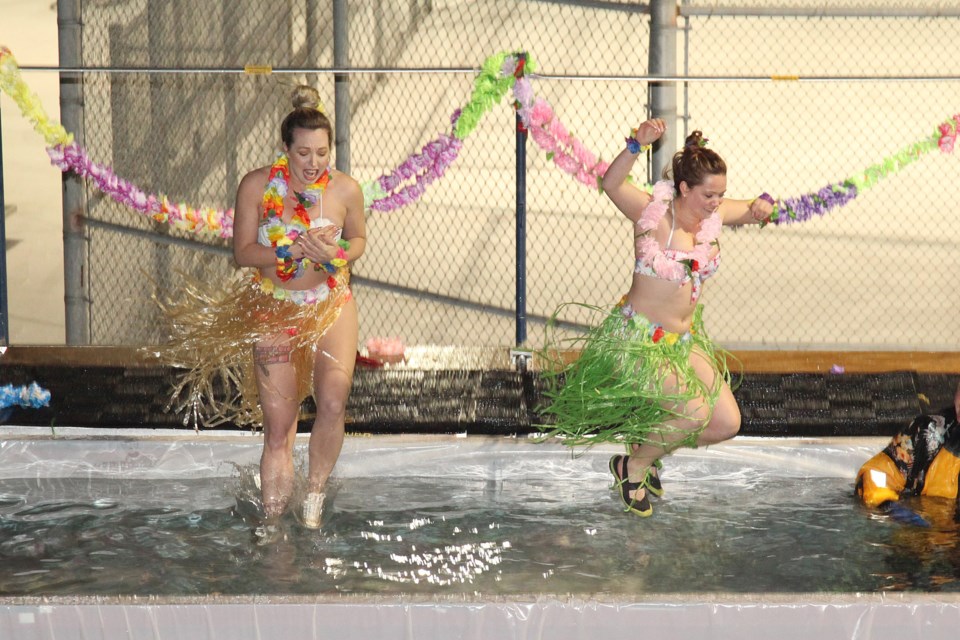 Anya Sitser and Amanda Masin froze their leis at the third annual York Regional Police Association Polar Plunge last night.  Greg King for NewmarketToday