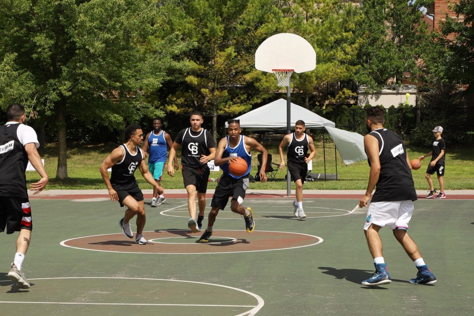The Youth Speak Dream Team commands the ball at the second annual 5 on 5 Hoops for Charity Basketball Tournament for Mental Health Awareness Saturday, Aug. 10 at Dr. Margaret Arkinstall Park. Greg King for NewmarketToday