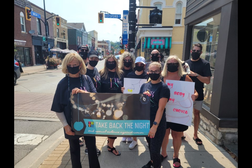 Abuse Hurts staff and volunteers gathered on Main Street in Newmarket.