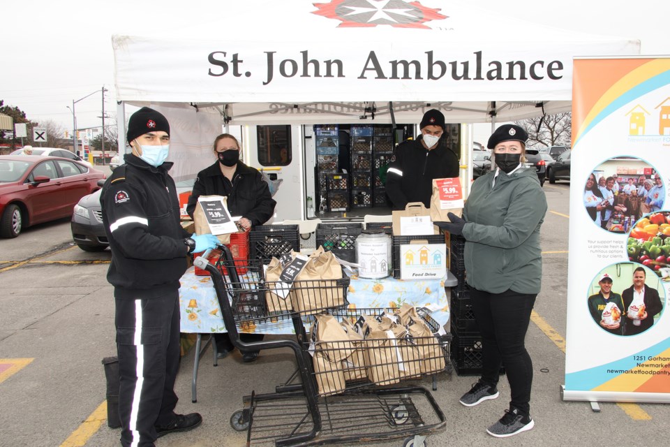 A donor who wished to remain anonymous donor gave two full carts of donated food at the St. John Ambulance Fill an Ambulance event for the Newmarket Food Pantry at Metro on Saturday.  St John Ambulance volunteers Nicholas Rocco, Kevin McCrudden, Lindsey Leamen, and Angela Rotherham-Watkins. Greg King for NewmarketTodayTh