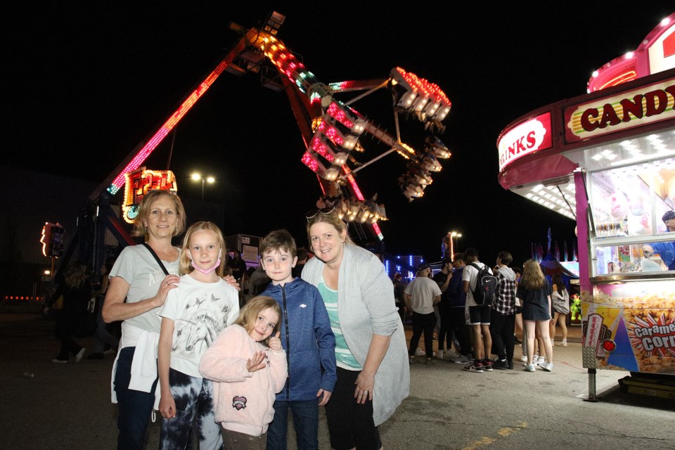 College Manor neighbours Nicole McKenzie with  Paige, Chloe, Aidan, and Melanie Raymond enjoyed the Joe Persechini Charity Midway at the Magna Centre parking lot.