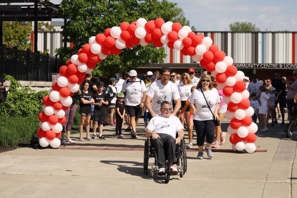 Easter Seals president and CEO Kevin Collins leads the walkers as the annual Easter Seals Run/Walkathon returns to Newmarket May 29 at Riverwalk Commons.  Greg King for NewmarketToday